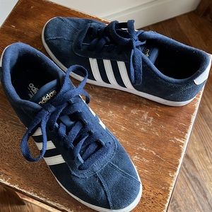 Navy suede adidas sneaker.